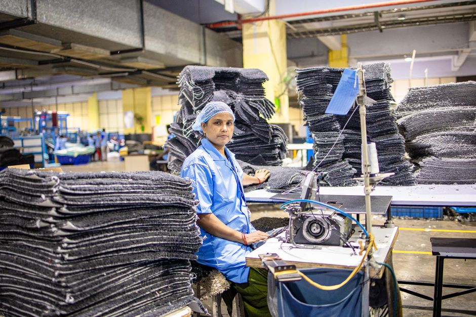 Factory worker operating machinery in an industrial setting